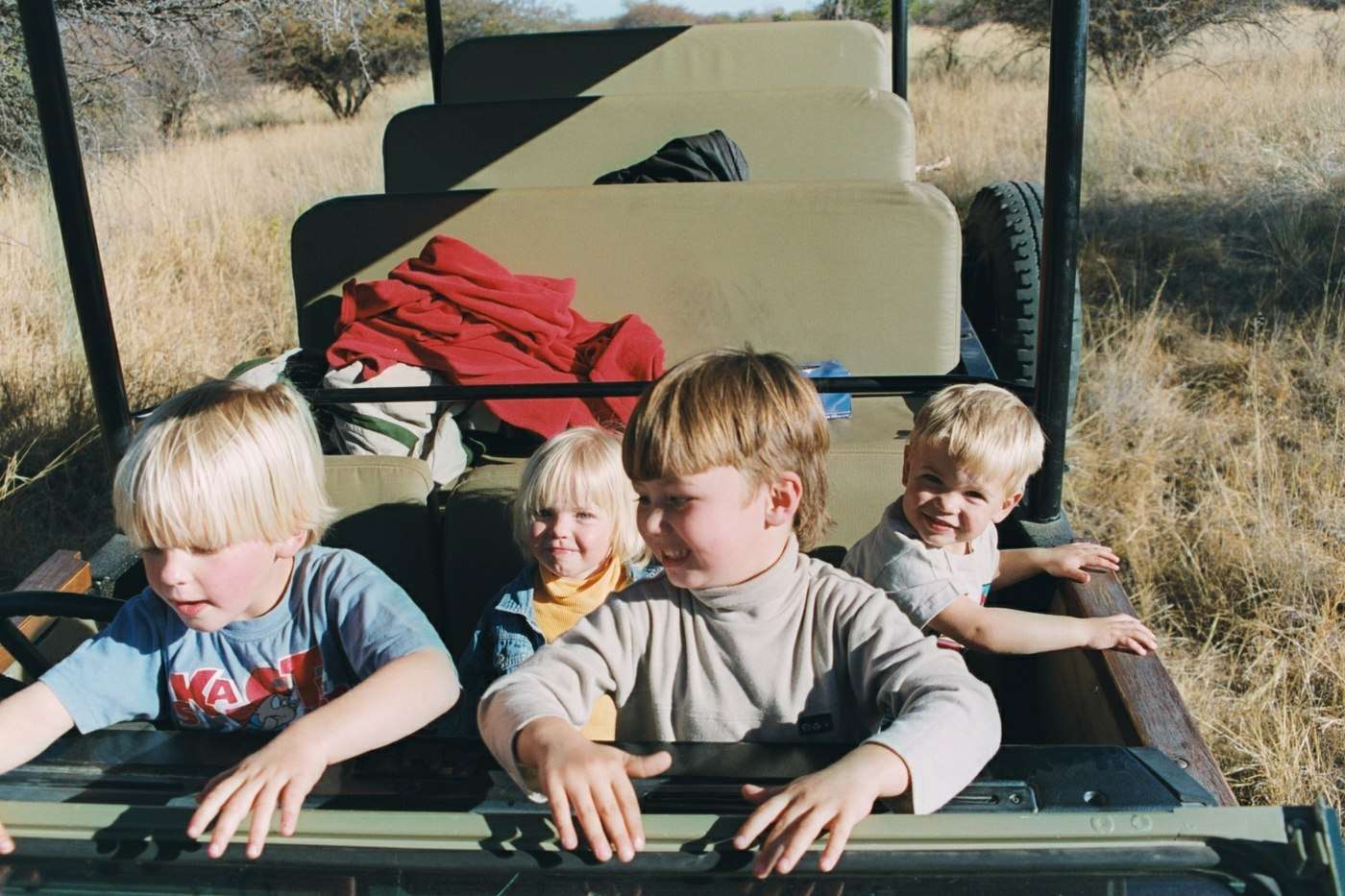 Children in the front of a game vehicle