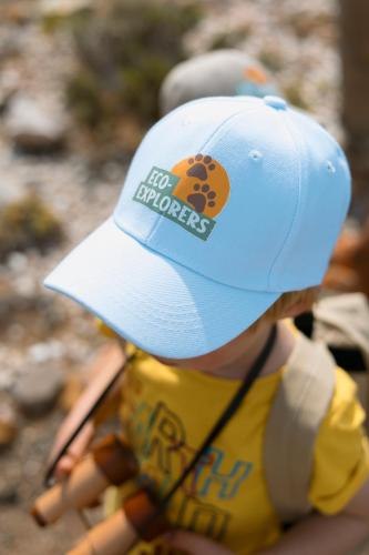 A child in a tracking cap