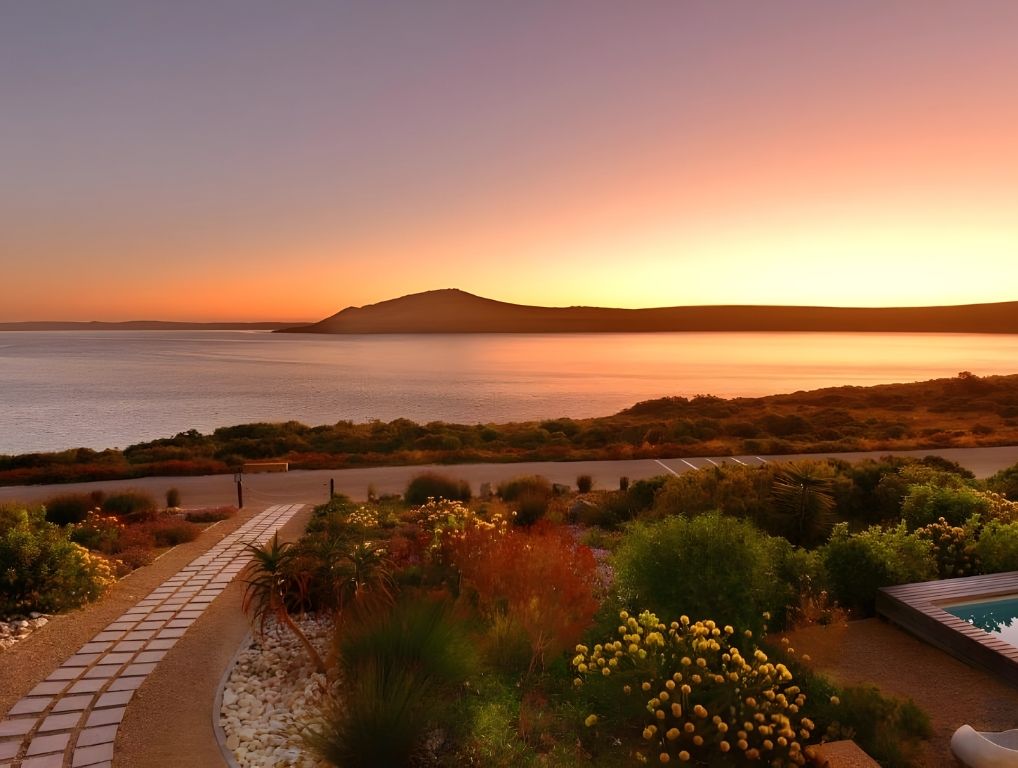 Sunset over the lagoon and the hill across the water, from the hotel garden