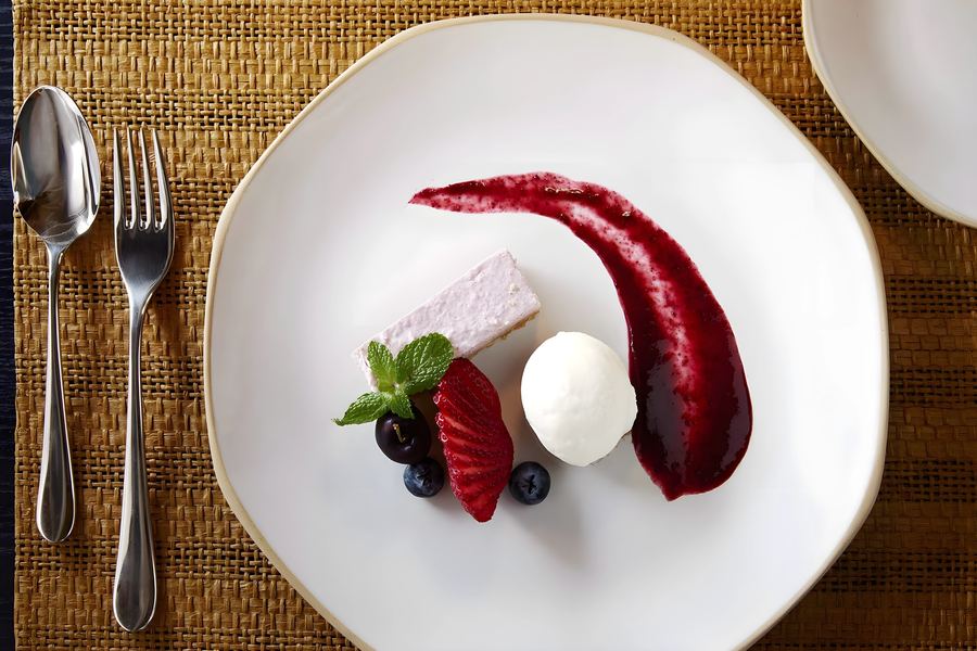 A berry cheesecake with ice cream