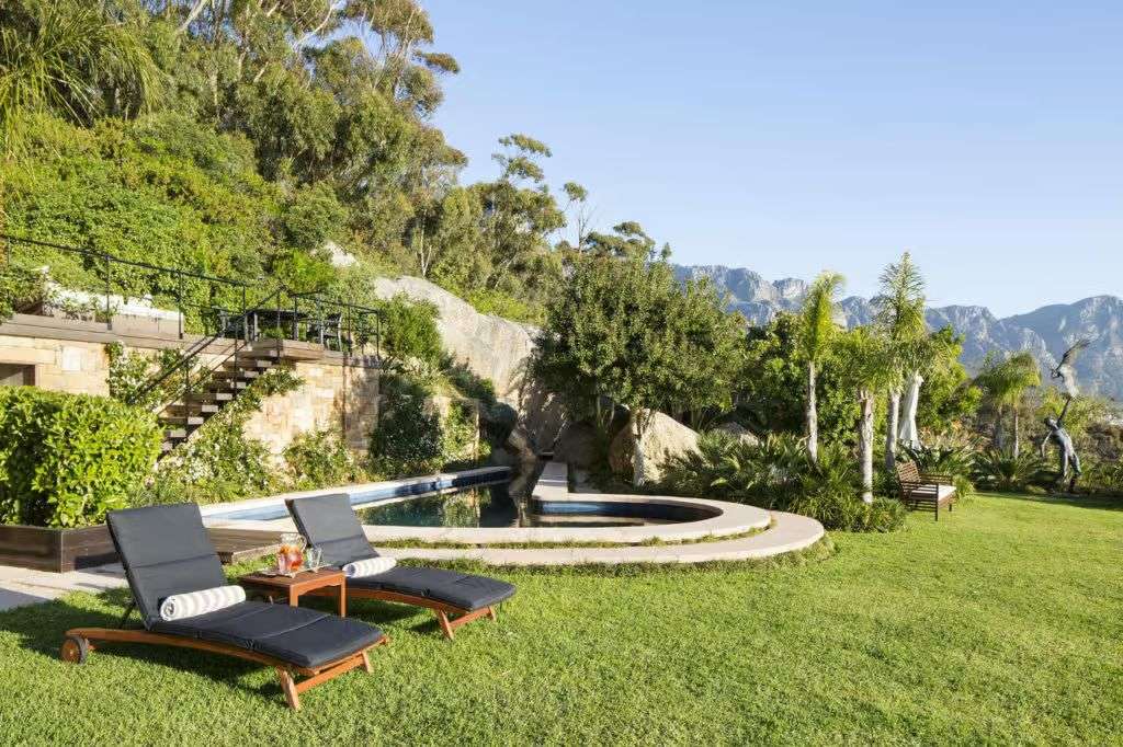 The lawn and pool, with the Twelve Apostles beyond