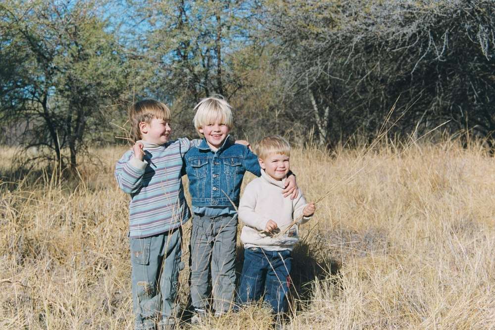 Three children in the veld