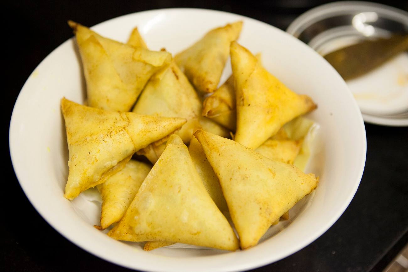 A bowl of golden Cape Malay samosas