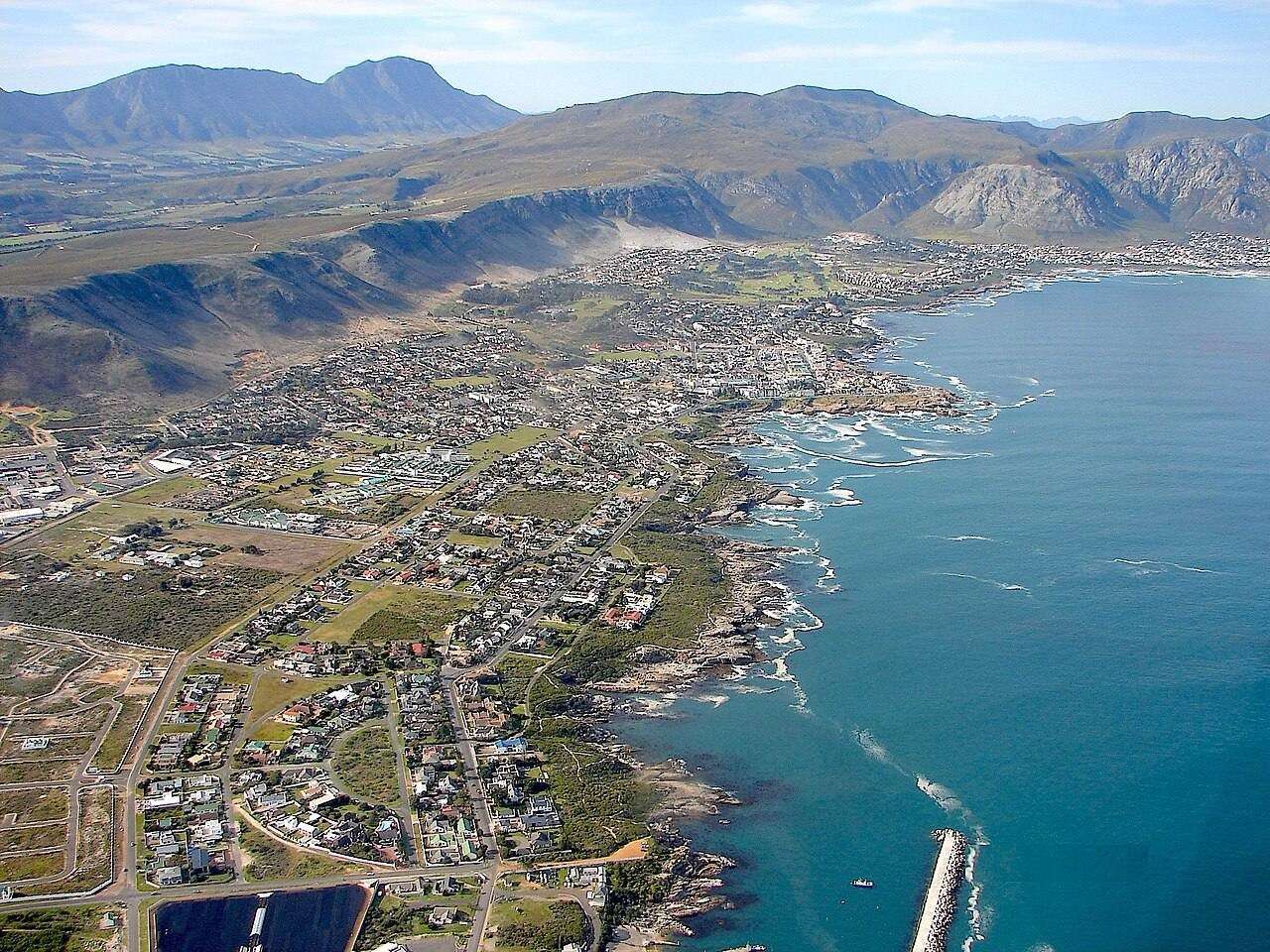 Hermanus spread along its rocky shore, seen from the air