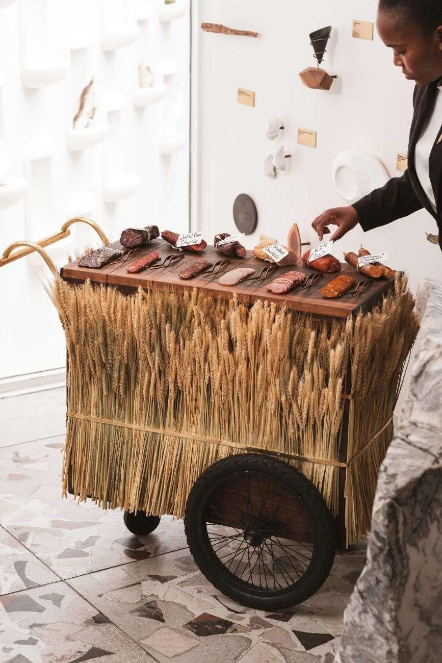 A little wooden cart wheeled through the restaurant