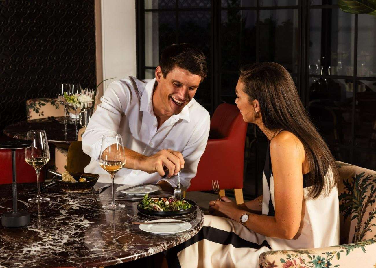 A couple dining in the Manor Kitchen
