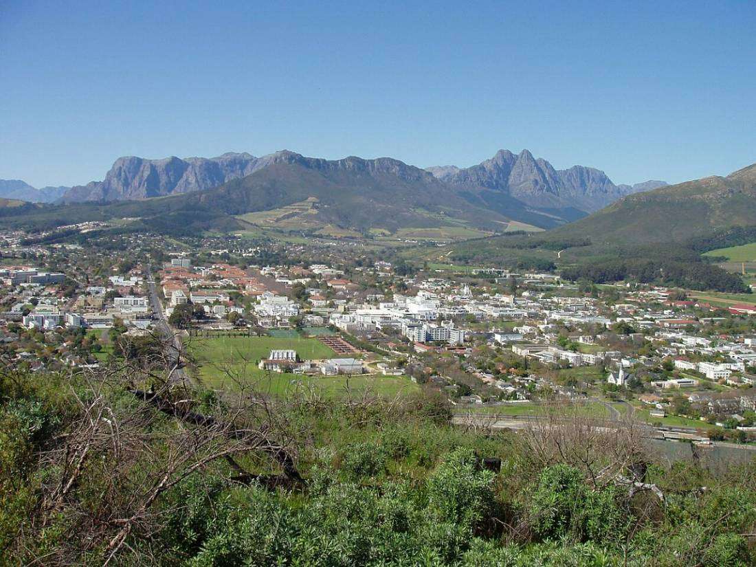 The town of Stellenbosch spread across its valley, with the mountains rising all around