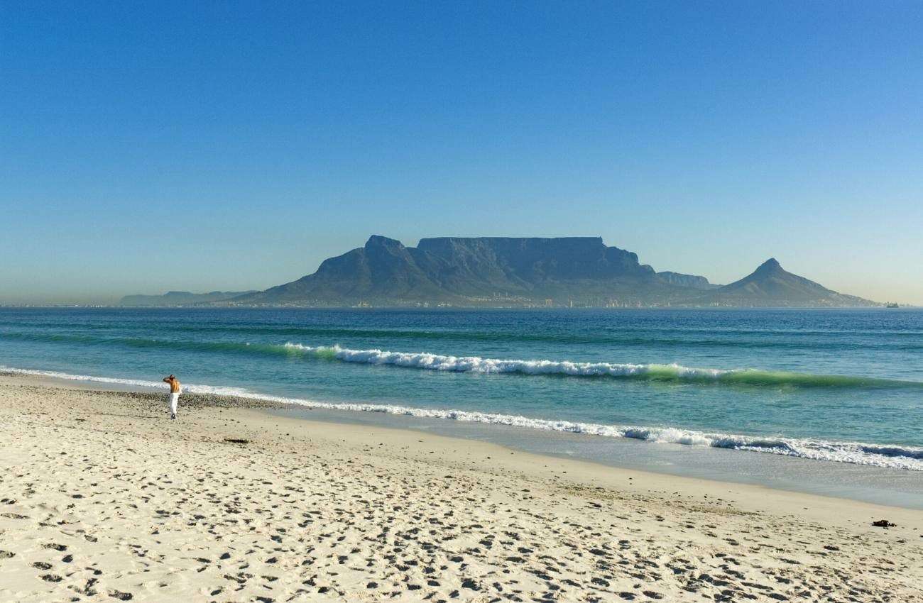 Table Mountain seen across Table Bay from the beach at Bloubergstrand