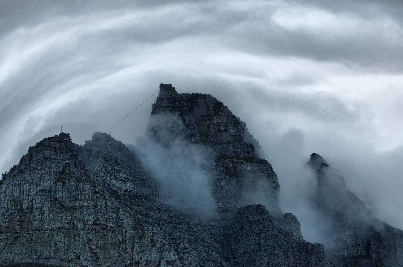 Cloud swirling through the crags of the mountain